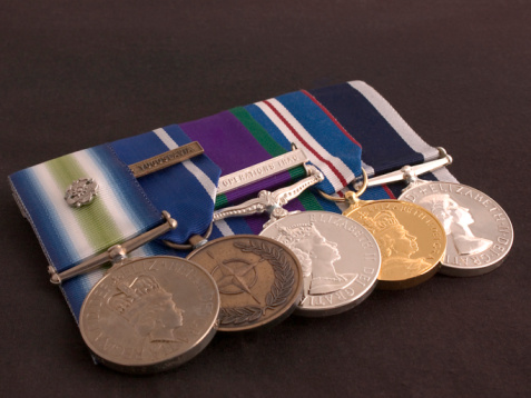 A U.S. military dress uniform with many medals and ribbons.