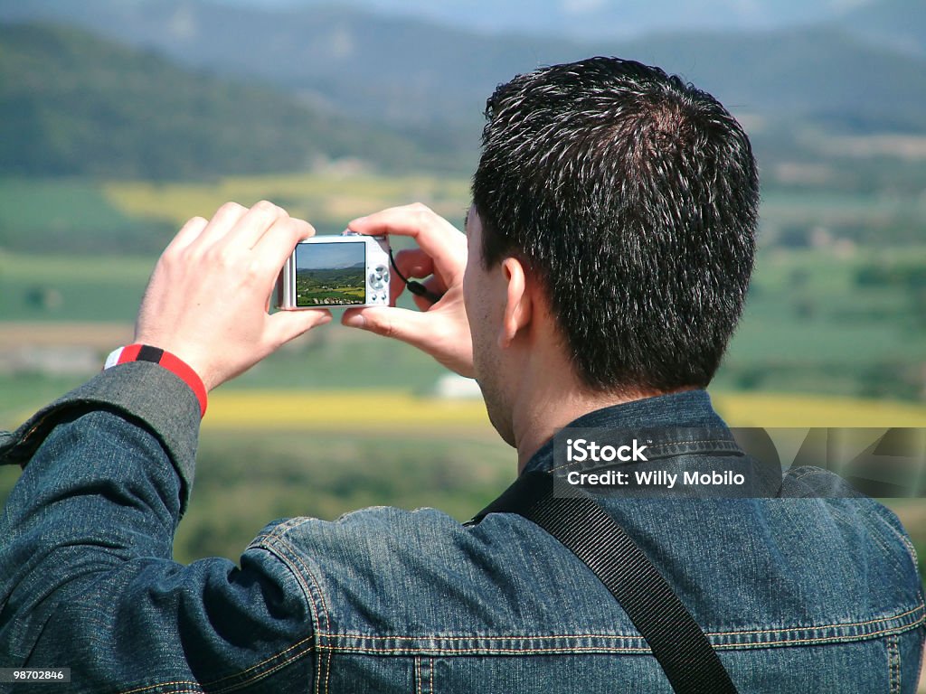 taking a picture asian man taking a picture Adult Stock Photo