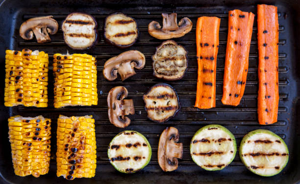 istock Grilled vegetables in a grilling pan, close-up. Top view, from above. 987032468