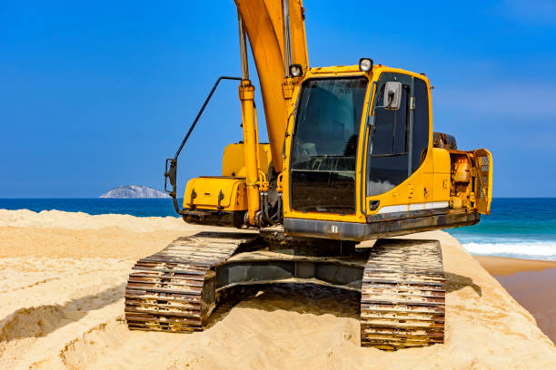 istock Yellow excavator cabin over sand 987041274