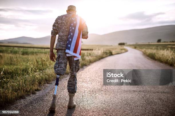 American Amputee Soldier On Road Stock Photo - Download Image Now - Veteran, Military, Disability