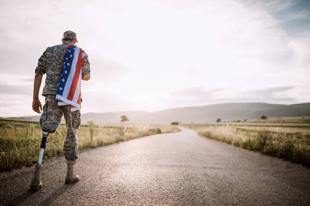 istock American Amputee Soldier On Road 987054650