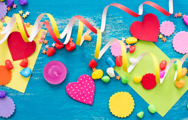 istock Festive confetti background heart candy color saturated. 987054910