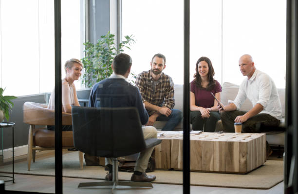 istock Five people meeting to discuss business 987070116