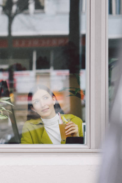 istock Successful businesswoman working in a coffe shop 987076476