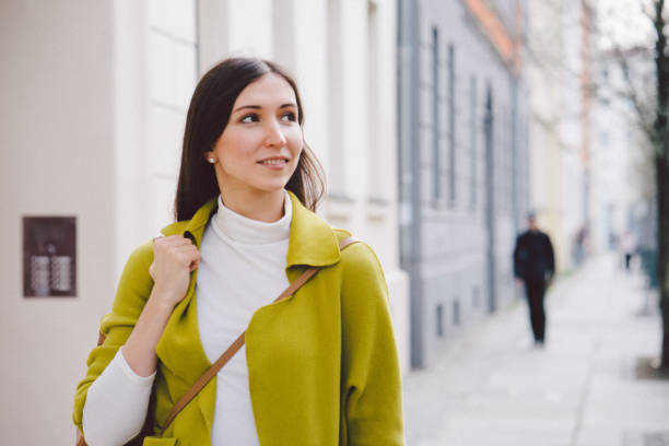 istock Woman walking city streets 987076748