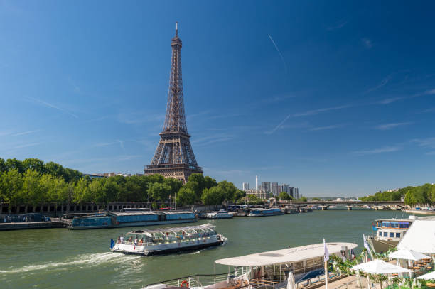 Paris, France - 23 June 2018: Bateau Mouche on the Seine river with Eiffel Tower in the background