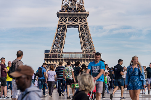 Paris, France - 23 June 2018: Eiffel Tower from Trocadero with many tourists in the foreground