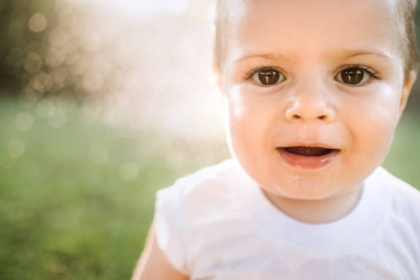 istock Baby Boy Enjoying First Summer Days In Nature 987123792
