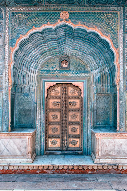 Indian door in Jaipur April 2018 - Jaipur, Rajasthan, India - Architectural features in the City palace in Jaipur palace photos stock pictures, royalty-free photos & images