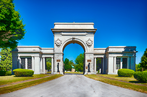 Buffalo, New York, USA - June 14, 2018:  The Forest Lawn Cemetery entrance arch was made in 1901.