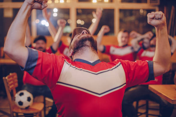 istock Cheerful soccer fans 987193488