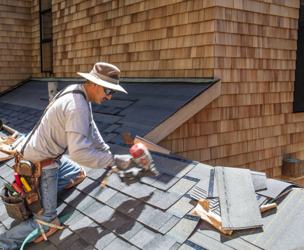istock Installing new roof with nail gun 987220196