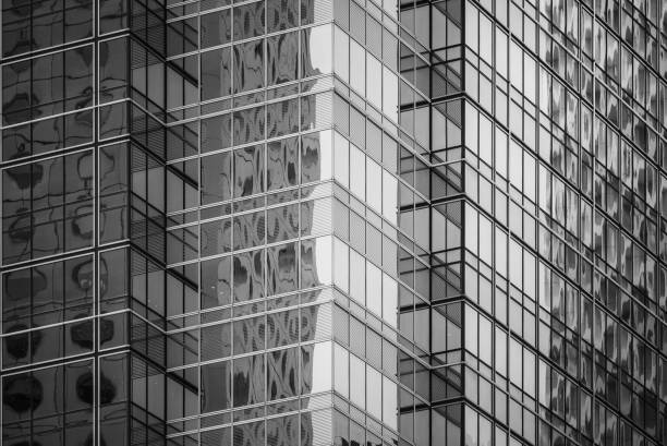 istock Modern office building detail, glass surface in Black & white color 987225428
