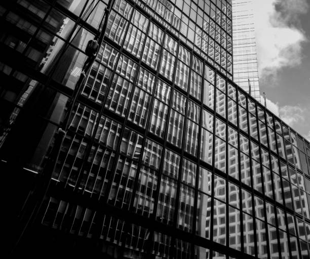 istock Modern office building detail, glass surface in Black & white color 987225518