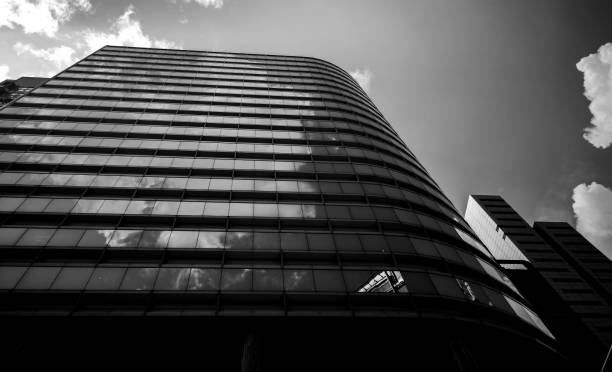 istock Modern office building detail, glass surface in Black & white color 987225574