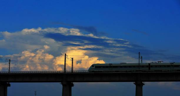 istock high speed railway  in blue sky 987237940