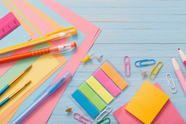 istock school supplies on  blue wooden background 987254108