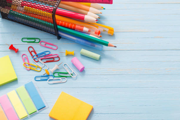 istock school supplies on  blue wooden background 987254122