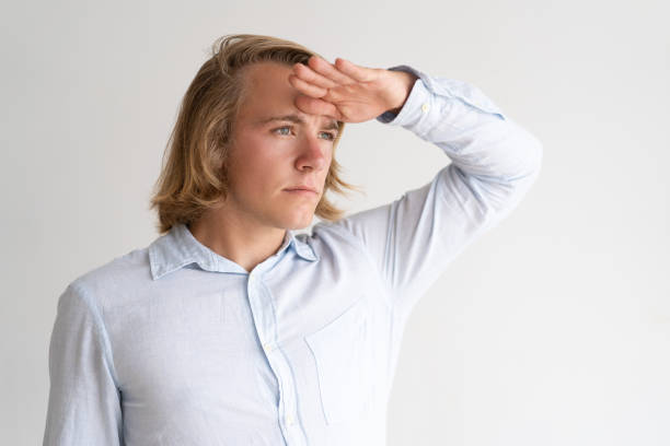 istock Serious young man looking into distance 987268806