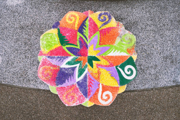 The finished rangoli decorated by multi-colored rice on the floor The rangoli or sand art or rice art with colorful decoration on the floor, one of the traditional part of indian wedding ceremony haldi ceremony stock pictures, royalty-free photos & images