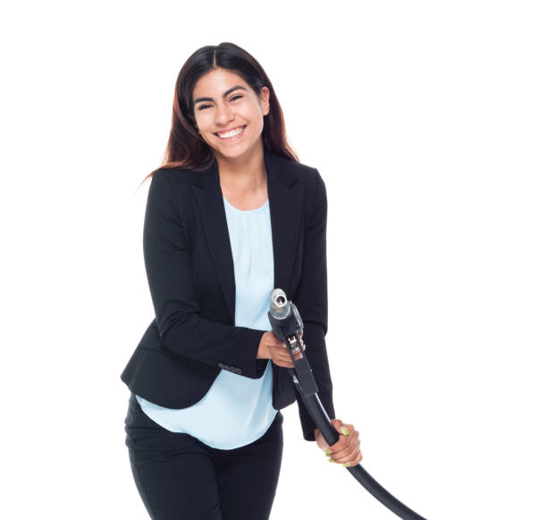 istock Businesswoman pumping gas 987270414