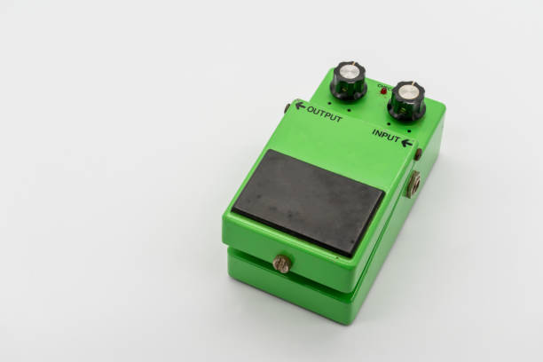 istock Green vintage guitar pedal isolated on white background 987275810