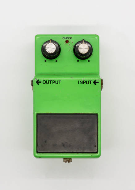 istock Green vintage guitar pedal isolated on white background 987275812