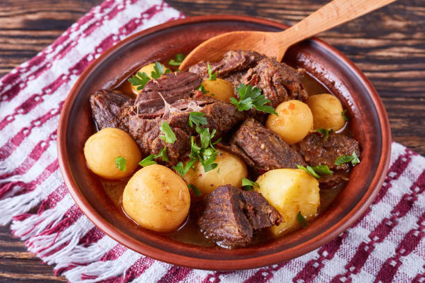 istock hot Beef Stew in a clay bowl 987276508