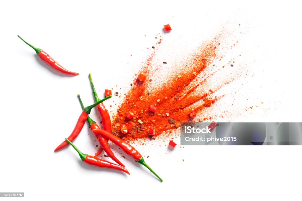 Chili, red pepper flakes and chili powder burst Spice Stock Photo