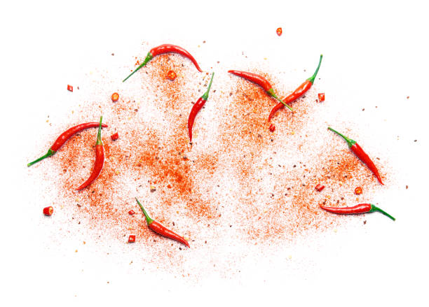 istock Red chili pepper and powder over white background 987277026