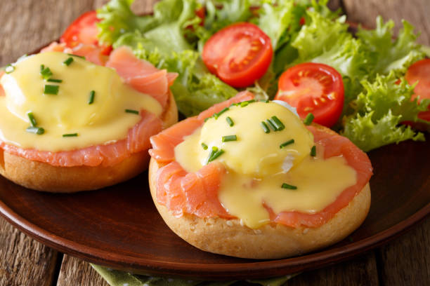 istock Eggs Benedict with salmon and hollandaise sauce close-up. horizontal 987297384