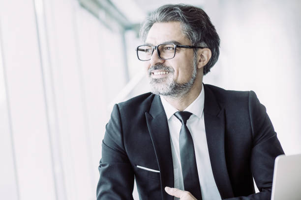istock Ambitious businessman working on new project 987298300