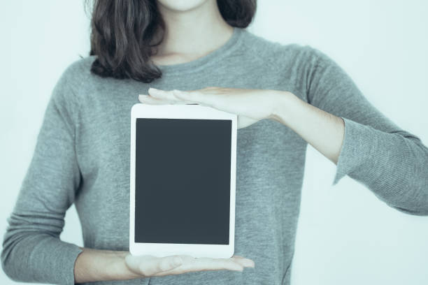 istock Cool girl holding digital tablet 987301886