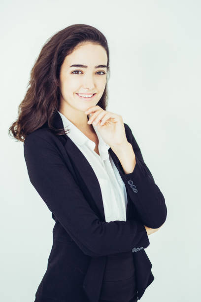 istock Cheerful ambitious young woman smiling at camera 987301910