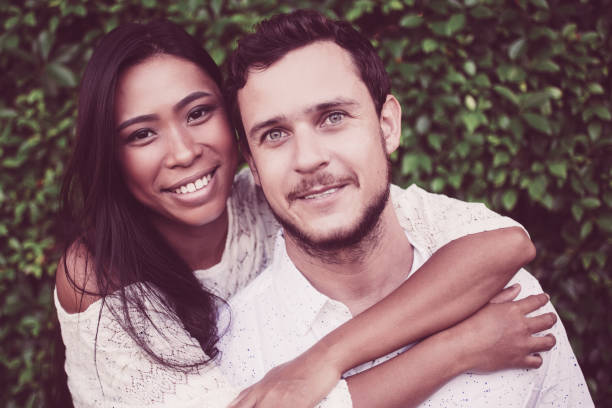 istock Closeup of Young Interracial Couple Hugging 987310662