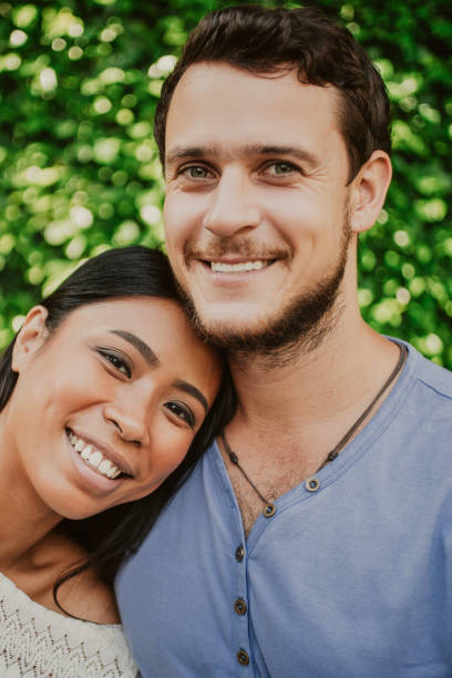 istock Happy Young Woman Leaning on Boyfriend Shoulder 987310720