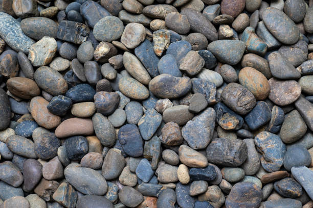istock abstract background with dry round pebble stones 987315250