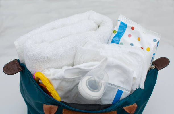 istock Maternity bag with baby stuff in 987316988