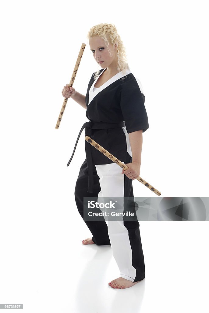 Escrima fight stick stance Martial artist with escrima sticks. Adult Stock Photo