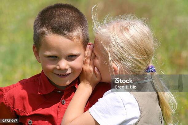Whispering And Smiling Stock Photo - Download Image Now - Blond Hair, Boys, Cheerful