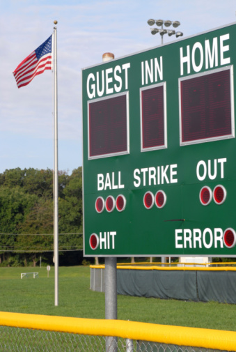 A score board on a baseball/softball field.