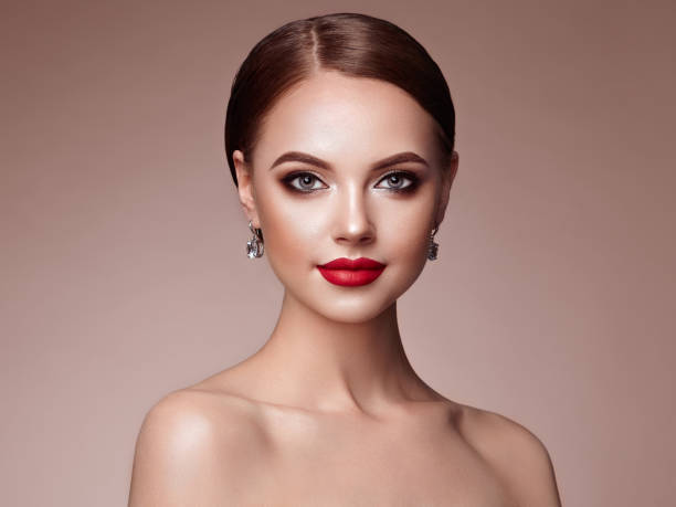 istock Beautiful woman face with perfect makeup 987342554