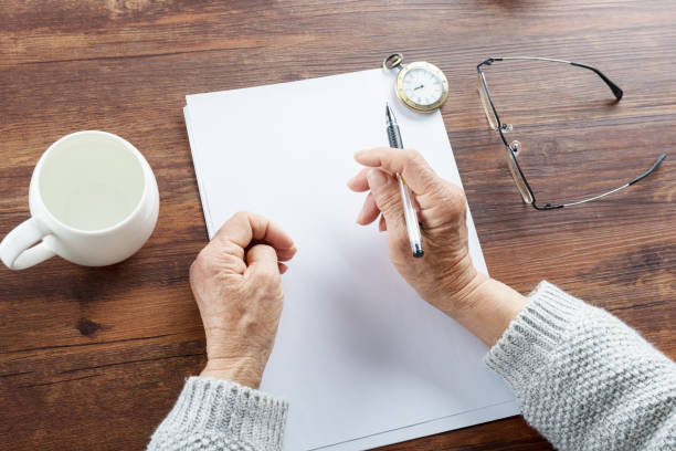 istock Old grandmother writing letters 987342898