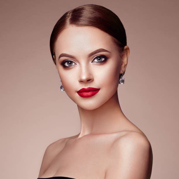 istock Beautiful woman face with perfect makeup 987342922