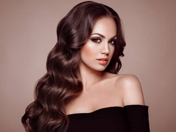 istock Brunette woman with curly hair 987343786