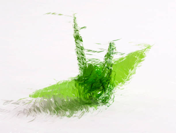 istock Green paper crane, origami - HD Digital illustration 987350252