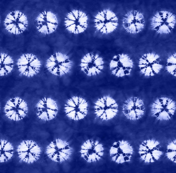 istock Seamless pattern, abstract tie dyed fabric of indigo color on white cotton. 987353258