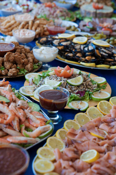 Selection of cold bits, sea food, meat, salads and sauces at a buffet bar, or self-service restaurant