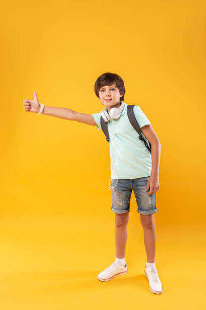 istock Content little boy trying hitchhiking 987365518